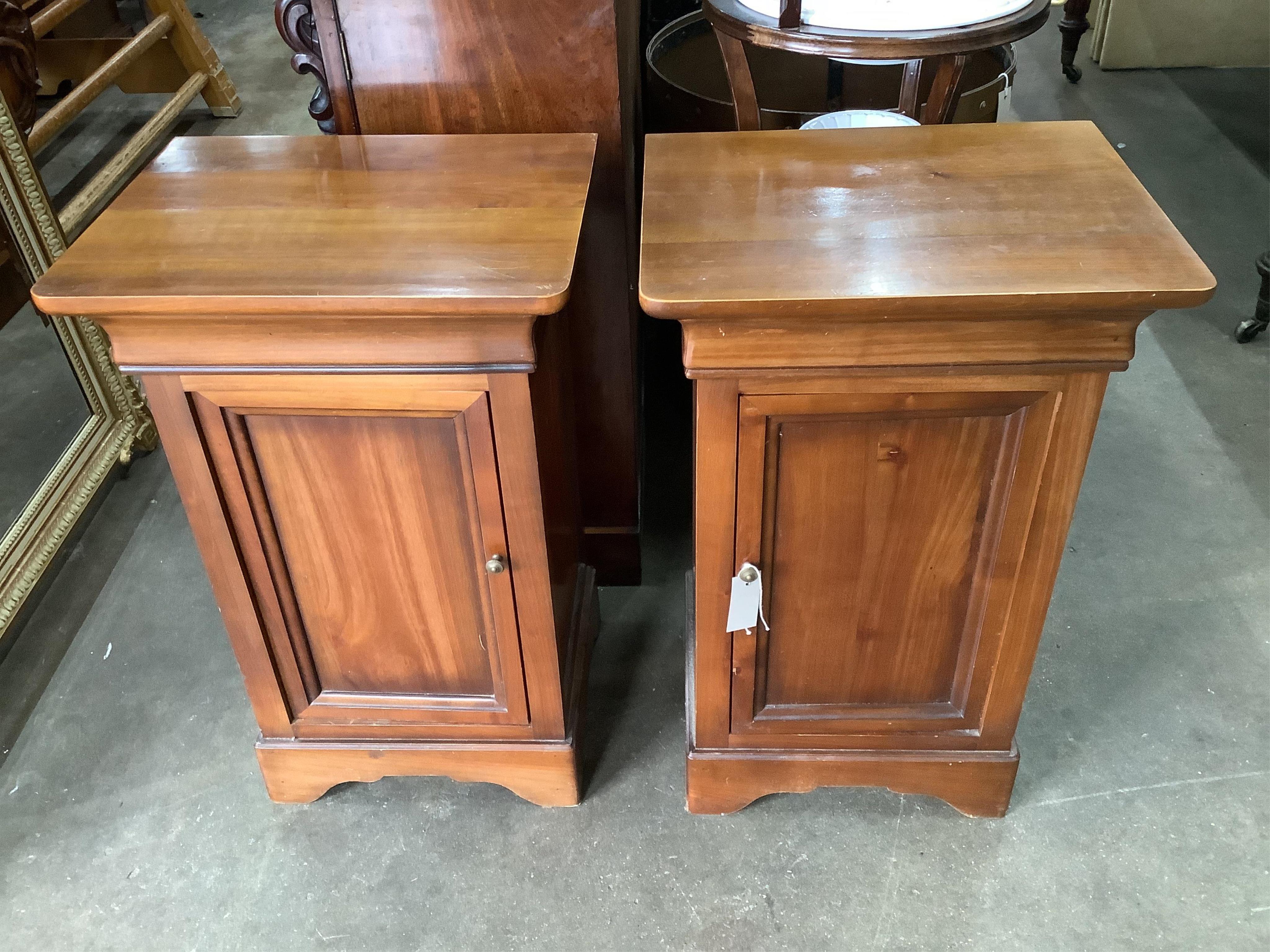 A pair of modern Continental cherry wood bedside cupboards, width 47cm, height 75cm. Condition - fair to good